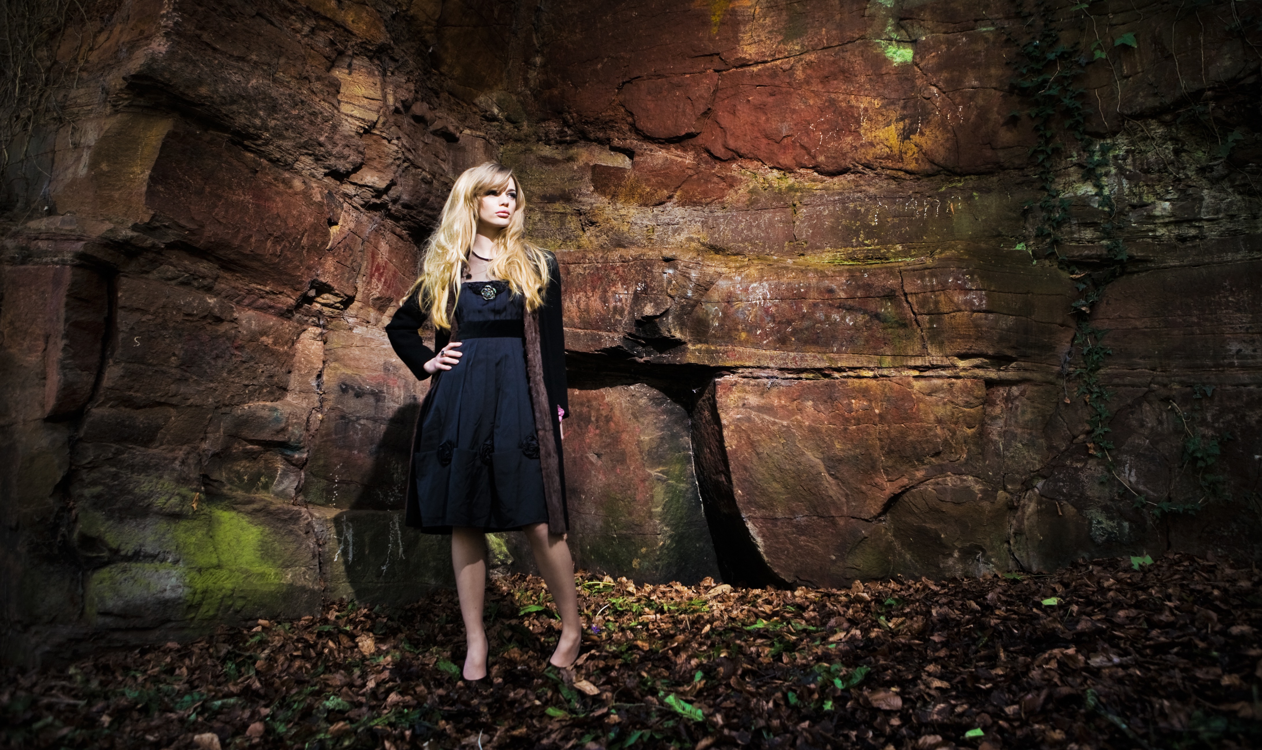 A woman stood in a cave