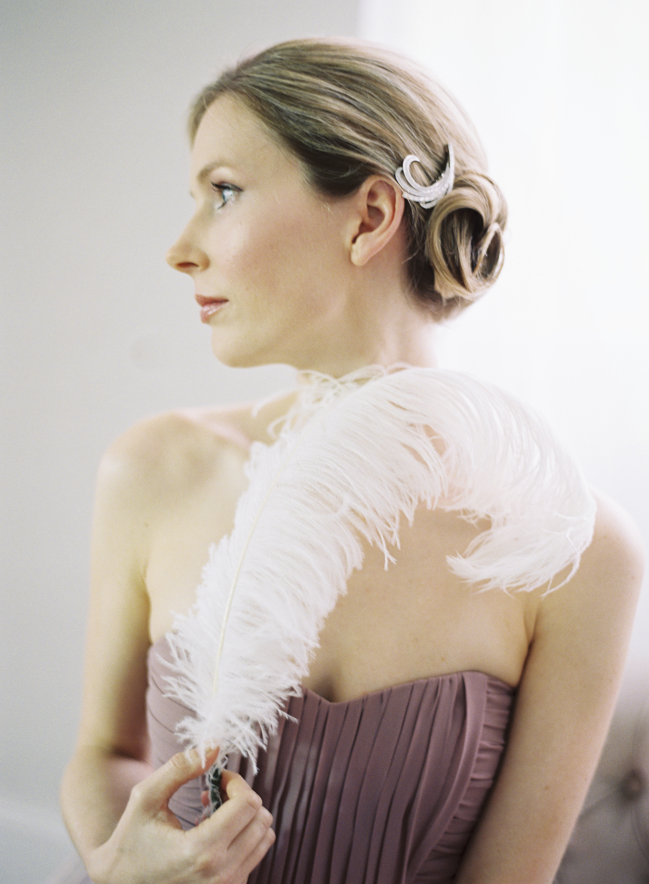 A woman holding a feather